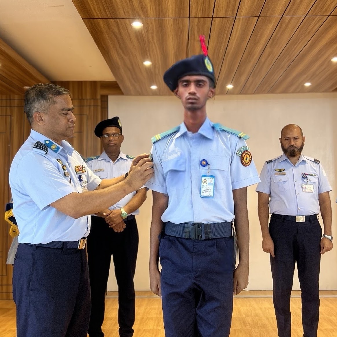 Cadet Shahriar Ahmed Receiving LCPL Rank Badge from Group Captain Md. Noor-e-Alam